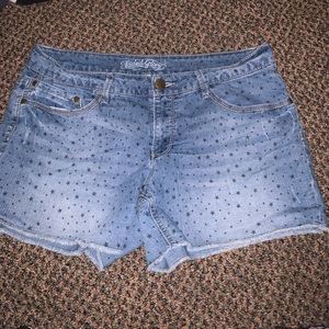 Blue Faded Glory denim shorts with stars on them.